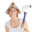 Foto: Pretty girl is painting her house Pretty girl is painting her house