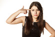 pretty girl puts a finger to his head and frowning