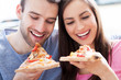 Couple eating pizza