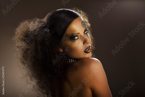 Photo: Coloring. Woman's Face with Golden Make-up. Creative Body Art Coloring. Woman's Face with Golden Make-up. Creative Body Art