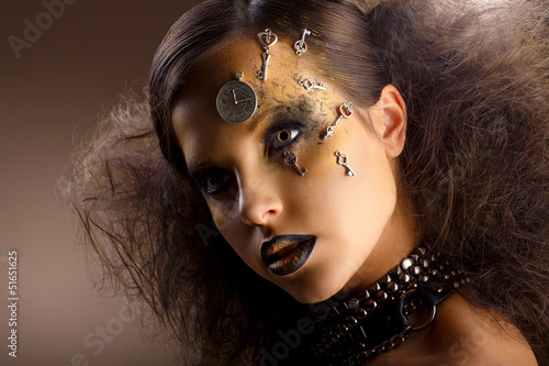 Photo: Artistry. Shiny Woman in Shadows. Golden Makeup. Creativity Artistry. Shiny Woman in Shadows. Golden Makeup. Creativity