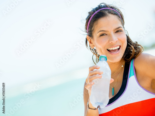 Photo: Sports woman drinking water Sports woman drinking water