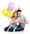 Photo: kid boy with parents looking at festive cake with candles kid boy with parents looking at festive cake with candles