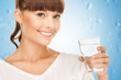 young smiling woman with glass of water