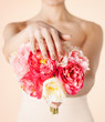 bride with bouquet of flowers and wedding ring