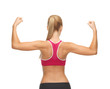 sporty woman showing her biceps