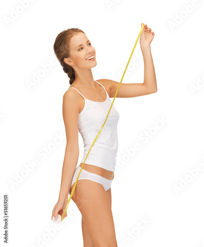 Photo: happy woman with measuring tape happy woman with measuring tape