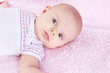 Newborn on pink blanket