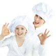 Mother and child having fun in the kitchen
