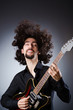Man playing guitar during concert