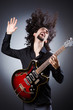 Man playing guitar during concert
