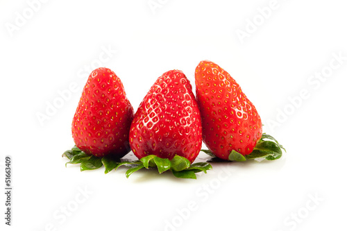 Photo: Strawberries with leaves. Isolated on a white background. Strawberries with leaves. Isolated on a white background.
