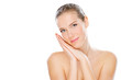 Skin care with young woman, studio shot