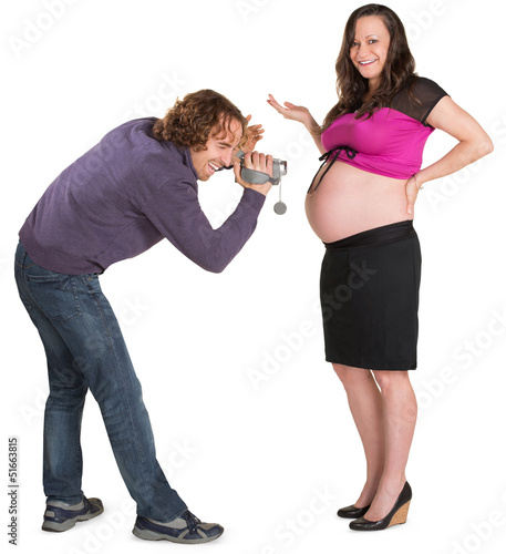 Photo: Father with Camcorder and Pregnant Woman Father with Camcorder and Pregnant Woman