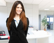 Smiling businesswoman in her office