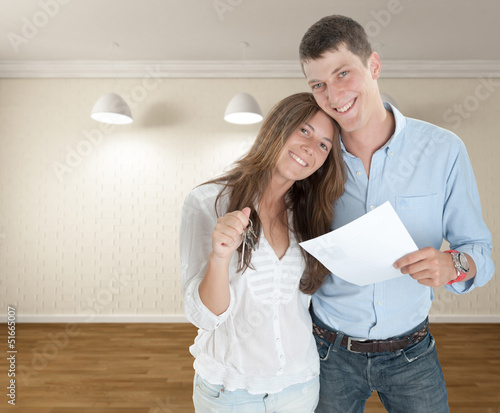 Photo: Young couple moving in Young couple moving in