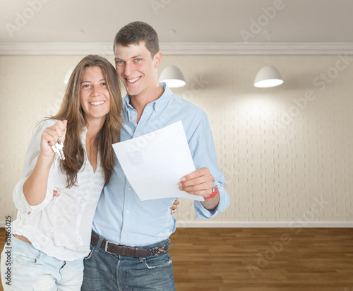 Photo: Young couple moving in Young couple moving in