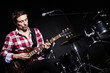 Man playing guitar during concert