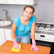 Foto: woman cleans the kitchen woman cleans the kitchen