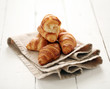 Fresh french croissants on a tablecloth