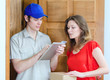 Young courier deliver package to pretty woman