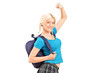 An excited young female student with raised hands