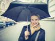 Photo: Beautiful Girl Is Posing at Street Holding an Umbrella During a Beautiful Girl Is Posing at Street Holding an Umbrella During a