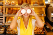 Bakery shopkeeper covers eyes with meringue