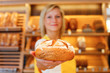 bakery saleswoman with loaf of bread