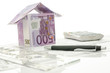 House made of money on a working desk
