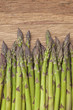 Photo: Green asparagus on a wooden background Green asparagus on a wooden background