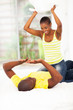 young african couple pillow fight