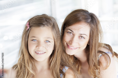 Photo: Beautiful young mother with her little daughter Beautiful young mother with her little daughter