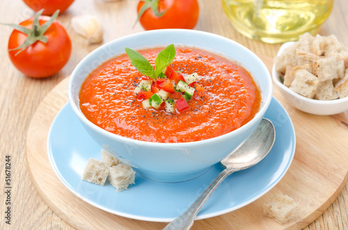 Photo: cold tomato soup gazpacho with basil, croutons in a bowl cold tomato soup gazpacho with basil, croutons in a bowl
