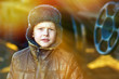 sunlight Boy bum homeless on street freezing close to railway ca