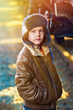 sunlight Boy homeless bum on street freezing close to railway ca