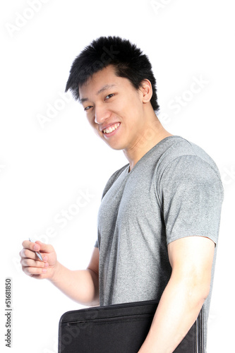Photo: Casual Asian Man with a Binder and Pen Casual Asian Man with a Binder and Pen