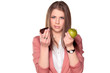 teenager girl holding apple and chocolate cake in her hands