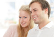 Photo: Portrait of a happy couple sitting together Portrait of a happy couple sitting together