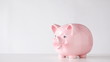 male hand inserting euro money into piggy bank