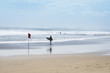 surfer walking kuta beach bali