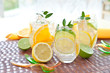 Fresh drink with orange, lemons and ice