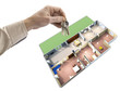 hand holding keys, house map in the background