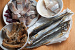 Assorted fish on wooden table. Top view