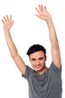 Photo: Cheerful young guy raising his arms Cheerful young guy raising his arms