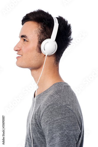 Photo: Handsome boy lost into musical world Handsome boy lost into musical world