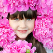portrait of little girl outdoors with peony