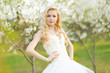 portrait of a beautiful bride in a lush garden