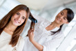 Photo: Stylist straightening hair Stylist straightening hair