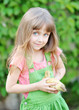 canvas print picture - portrait of a little girl and duckling